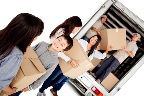 Man and van team protecting furniture during a move