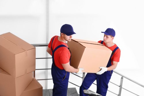 Team loading items safely into a van during a planned move