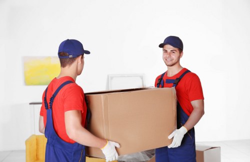 Student removals team loading boxes for a London university move