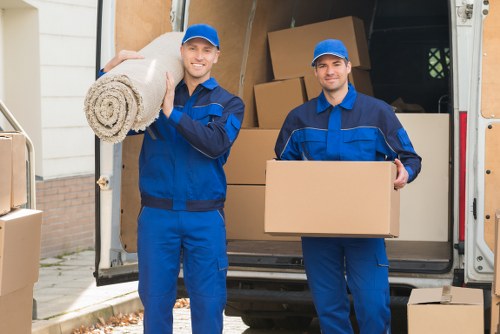 Moving truck service navigating a London residential street