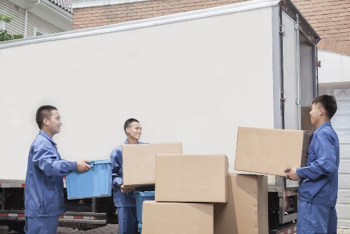 Moving van outside a typical London apartment building