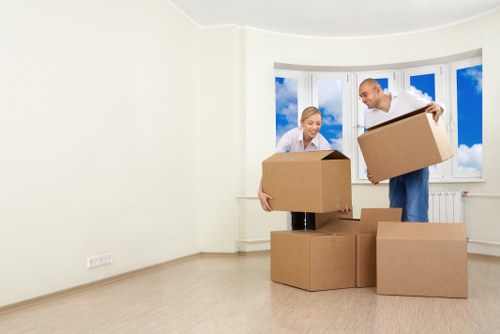 Man with van service helping with a London move and loading furniture