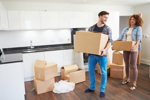 Local London team organising boxes for a move
