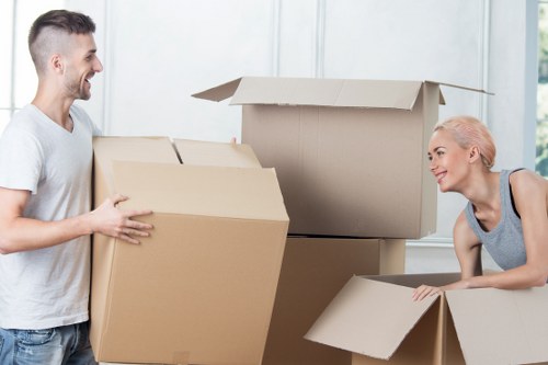 Moving team handling boxes and furniture in a London street