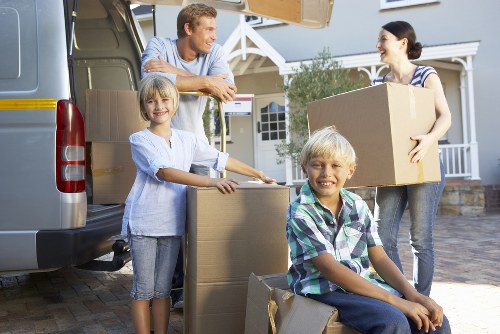 Loading furniture and boxes into a van for a London move