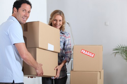 Packed moving boxes and furniture loaded into a removal truck