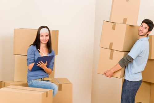 Office furniture being moved through a London commercial building